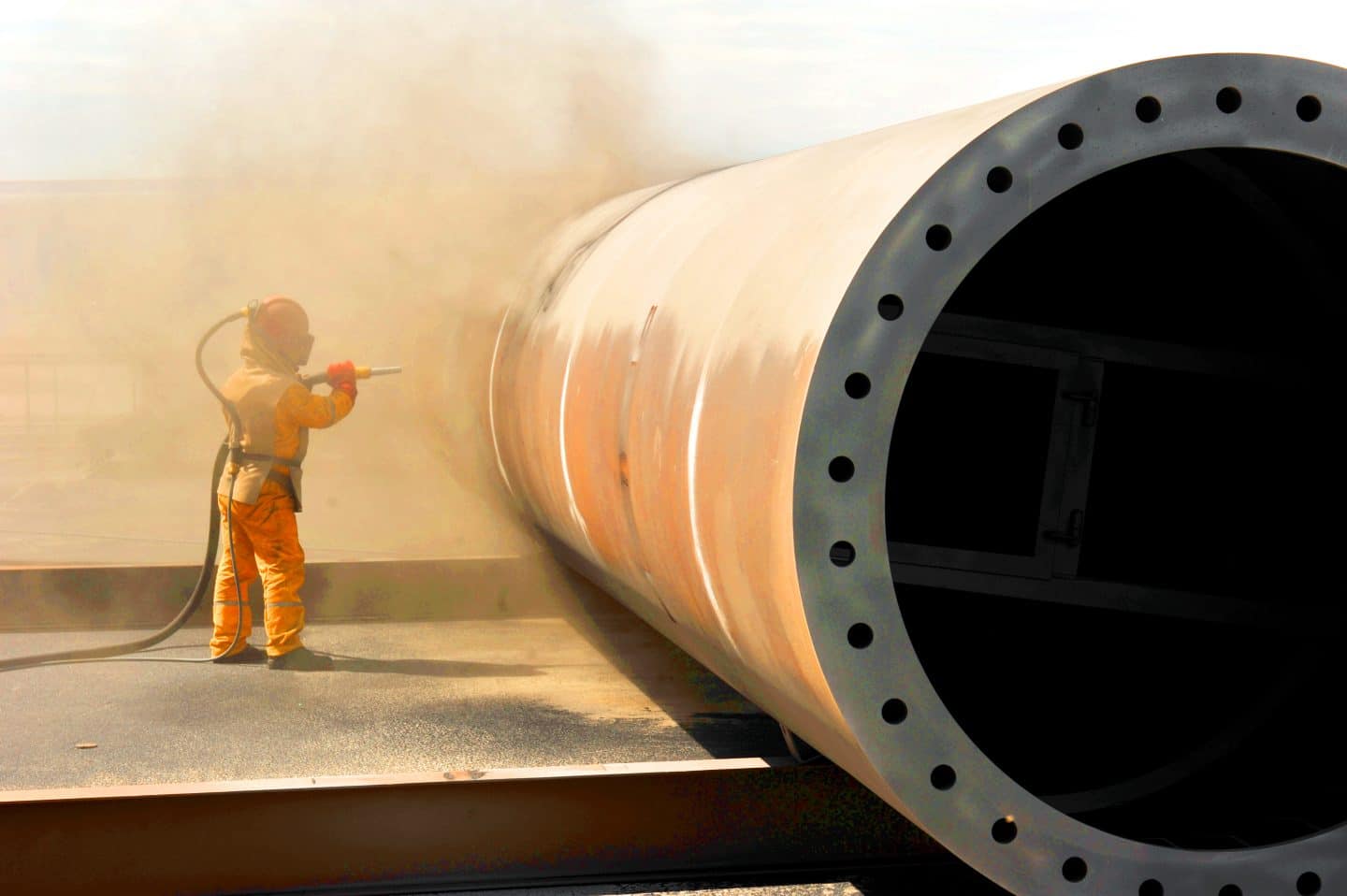 Steel fabrication facility using nickel slag for surface preparation
